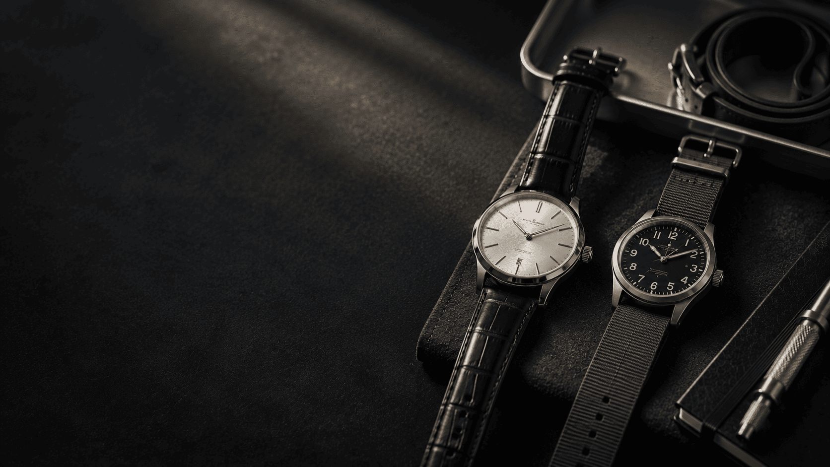 Premium affordable watches on a dark desk with leather strap and pen
